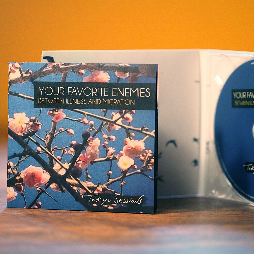 BETWEEN ILLNESS AND MIGRATION – DELUXE: TOKYO SESSIONS – CD 2016 [Audio CD] Your Favorite Enemies and .